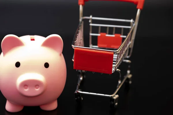 Piggy Bank Shopping Cart Black Background Dollars — Stock Photo, Image