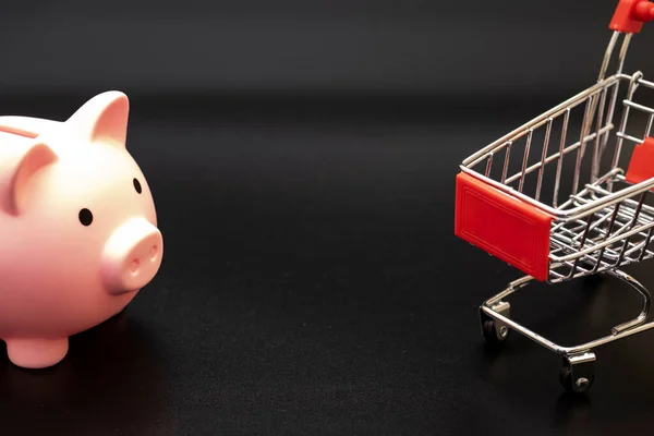 Piggy Bank Shopping Cart Black Background Dollars — Stock Photo, Image
