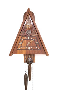 Vintage cuckoo clock isolated for creative background.cuckoo clock hanging on the wall.