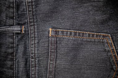 Kot pantolonun yakın görüntüsü. Geleneksel iş arkaplanı için canlı renklerde kot dokusu