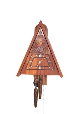 Vintage cuckoo clock isolated for creative background.cuckoo clock hanging on the wall.