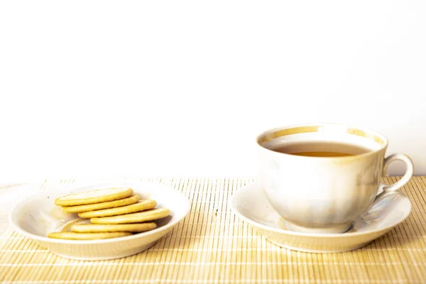 stock image Top view of herbal tea in a cup and teapot on marble. English breakfast