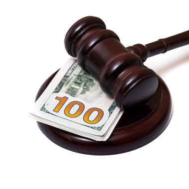Judge's gavel and 100 american dollar banknotes on white background
