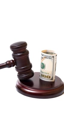 Judge's gavel and 100 american dollar banknotes on white background