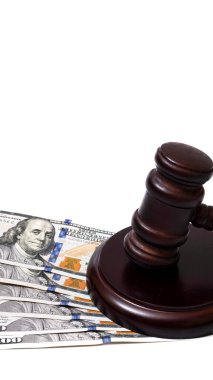 Judge's gavel and 100 american dollar banknotes on white background