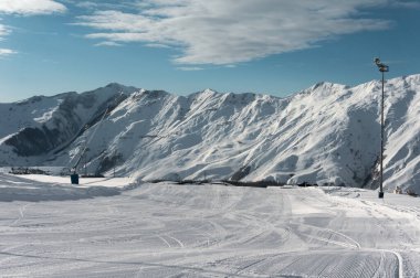 clean skiing trek at top of snow hill at alpine resort