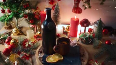 gluhwine and mulled wine with orange, anise, vintage bottle at cozy new year eve