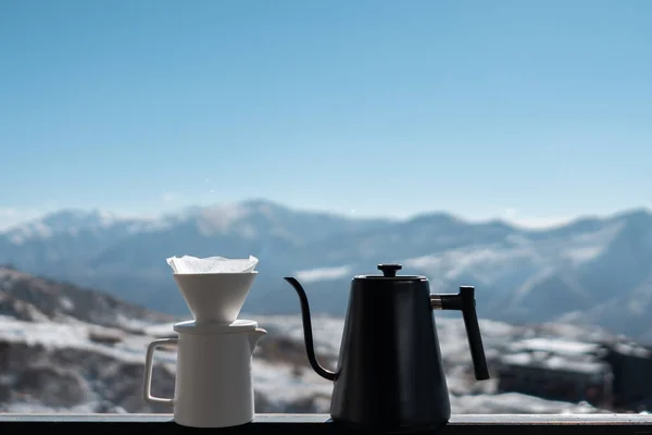 delicious filtered black coffee on mountain background