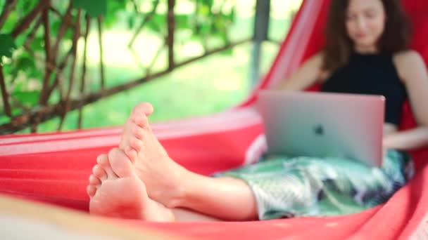 Selective Focus Feet Girl Swinging Resting Hammock Netbook Nature Summer — Stock Video