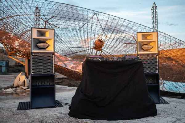 live dj set by abandoned industrial antenna dish, Tenerife, Canary island. High quality photo