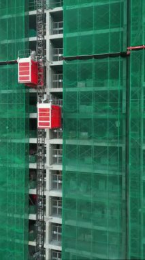 İnşaat kaldırma malzemeleri, endüstriyel güç ve inşaat ilerlemesi, malzeme kaldırma yükseltme malzemeleri, yapısal gelişim ve operasyonel verimlilik. Yüksek kalite 4k görüntü, dikey video 