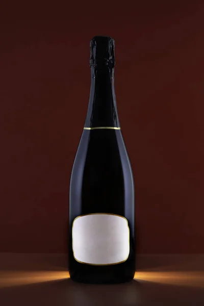 Black Champagne bottle with mock up on red background.Greeting card for love, marriage, Valentines Day,birthday,celebrations and festivities.