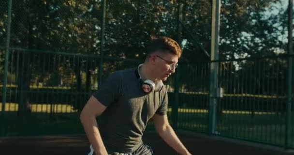 Sportman Wears Fashionable Sportswear Glasse Modern New Headphones Looks Camera — Stockvideo