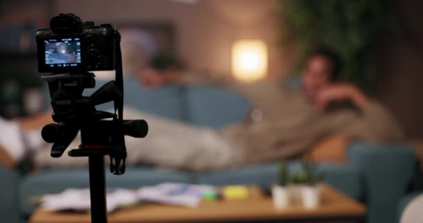 African American mindfulness practitioner lying comfortably on the couch, this African American man speaks to the camera about the importance of mindfulness and inner peace.
