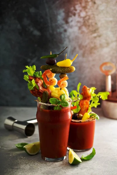 Bloody mary cocktail topped with variety of generous garnishes