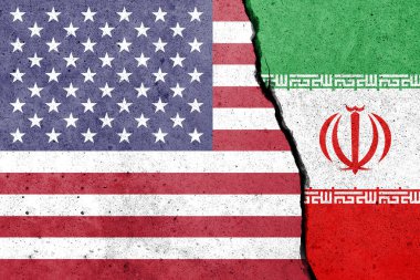 Beton duvara Amerika Birleşik Devletleri ve İran bayrakları çizildi. ABD ve İran çatışması