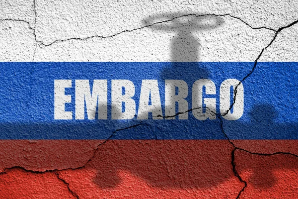 stock image Flag of Russia painted on a wall with gas, oil pipe shadow. Embargo and sanctions for military aggression