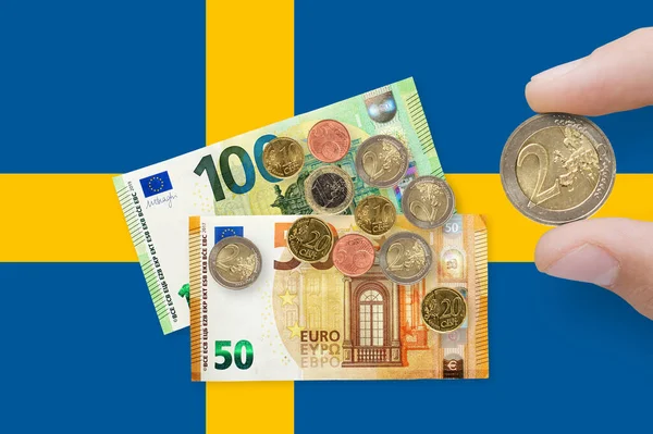 stock image Currency of European Union over Sweden flag. EUR is the official currency of the European Union. The concept of financial crisis and recession