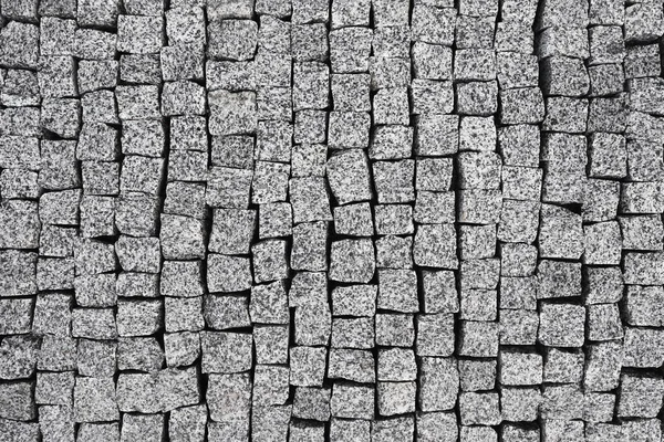 Overhead view of cobblestone street texture. Stone pavement texture
