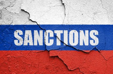 Flag of Russia painted on a wall with word SANCTIONS. Embargo and sanctions for military aggression. 