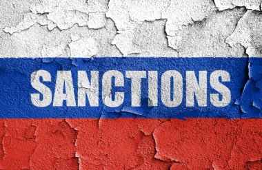 Flag of Russia painted on a wall with word SANCTIONS. Embargo and sanctions for military aggression. 