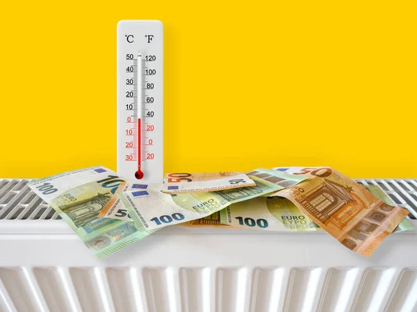 Euro banknotes on home heating radiator with thermometer. Energy crisis and expensive heating costs for winter season. Big heating and gas bill. Thermometer shows plus 3 degrees warm