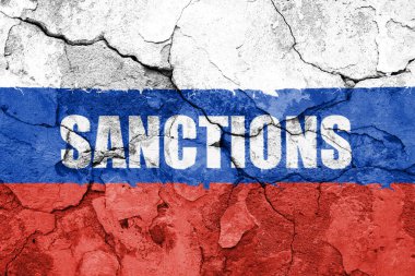 Flag of Russia painted on a wall with word SANCTIONS. Embargo and sanctions for military aggression. 