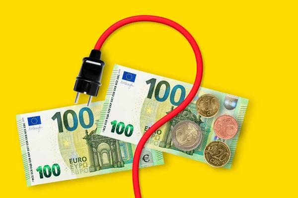 Euro banknotes on a yellow background. Energy crisis and expensive electricity, gas price. Big heating, gas and electricity bill