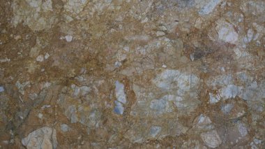 Çatlakları ve çizikleri olan taş bir duvarın dokusu arka plan olarak kullanılabilir.