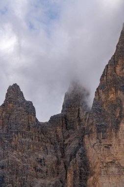 Dolomites natural landcape in fog with moumtain peak Drei Zinnen in Italy