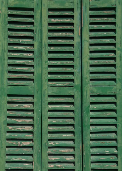 wooden, green, old shutters on the window