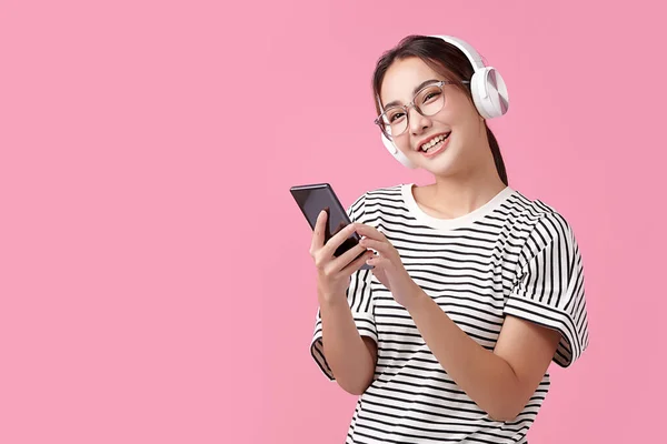 Happy Young Asian Woman Wearing Wireless Headphones Listening Music Smartphone — Stock Photo, Image