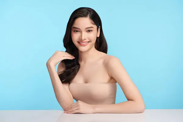 Beautiful Young Asian Woman Clean Fresh Skin Blue Background Face — Stockfoto