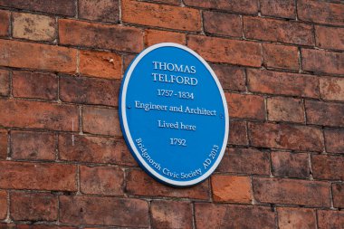 Bridgnorth, UK  April 12th 2024: Blue plaque outside of the house where the Engineer and architect,  Thomas Telford lived. clipart