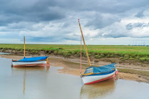 stock image Colourful boats on the River Glaven in Blakeney, North Norfolk, UK