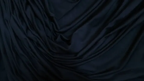 mavi ipek kumaşın arka planı. Bu soyut güzel kumaş..