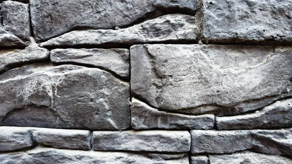 Eski gri tuğla duvar arkaplanı, taş duvar, taş bloklar.