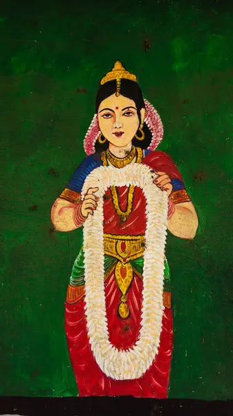 Hindistan 'da kırmızı duvarda bir Hindu tanrısı heykeli..