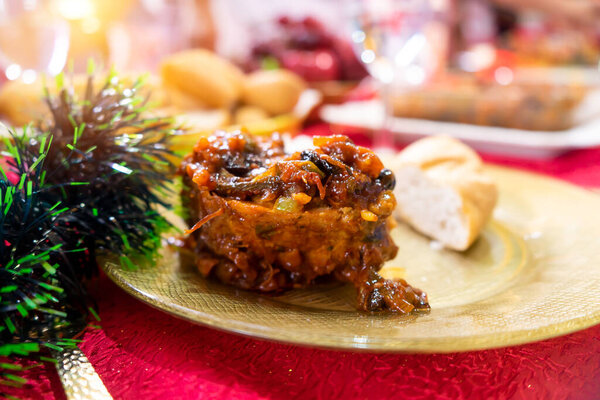 A portion of stuffed loin accompanied by bread, a traditional dish from Nicaragua and Latin America during Christmas