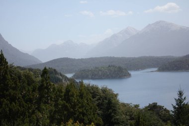 Mountains and lakes with forest in Patagonia daylight afternoon