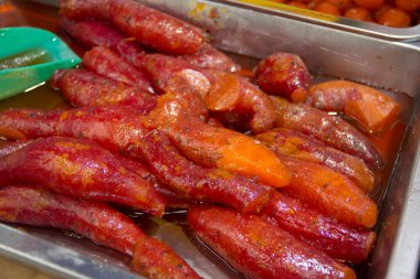 Traditional Mexican street food, candied sweet potatoes, close-up. clipart