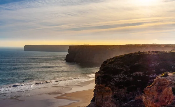 Sunset in the Atlantic Ocean. Cliffs and ocean around the sagres fortress. Coast of Sagres in the Algarve from the Sagres Fortress, Portugual. Portugal landscape, Seascape. High quality photo