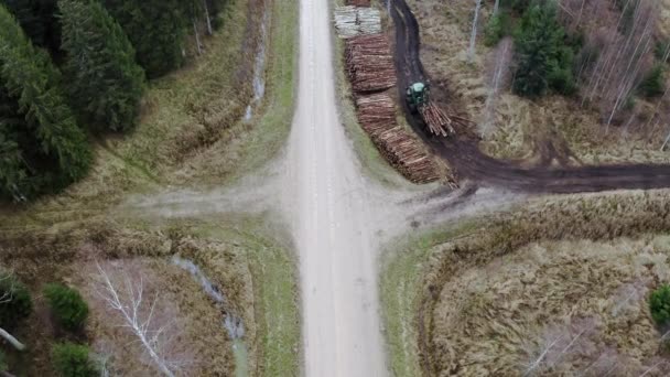 Aerial Shot Tractor Puts Wood Trees Stocks Working Process Timberland — Stock Video
