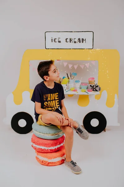Lovely kids selling ice cream on ice cream truck stand