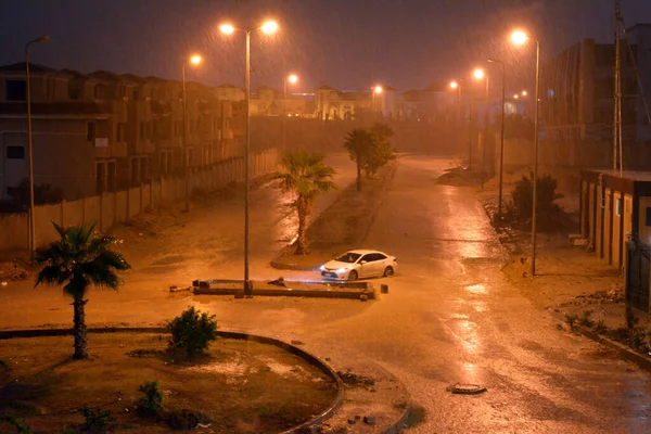 stock image Cairo, Egypt, October 25 2022: foggy unclear scene of the streets due to heavy rains flooding with stormy wind, thunder and lightning in Cairo, Egypt, selective focus of rainy floods weather at night