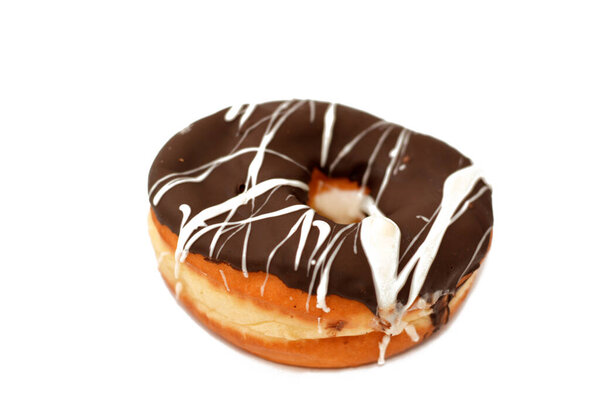 Brown and white chocolate ring donut, A glazed, yeast raised, American style ring doughnut, type of food made from leavened deep fried dough sweet snack, selective focus and isolated