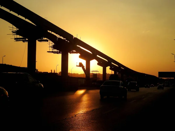 stock image Cairo, Egypt, October 21 2022: A Silhouette of a construction site of Cairo Monorail which is a two-line monorail over road rapid transit system currently under construction, elevated rail transport