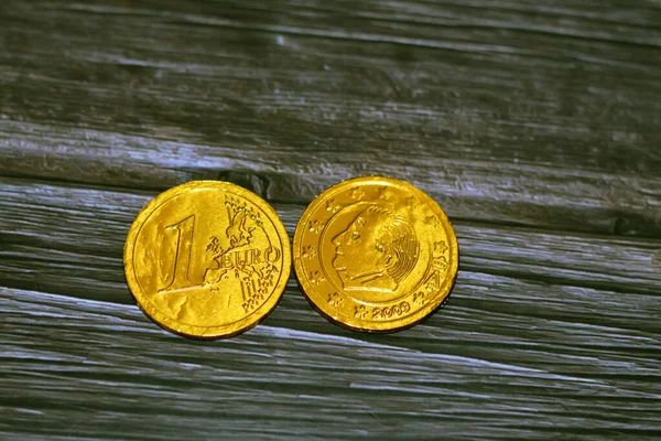 stock image Chocolate euro coin depicts king Albert II and a monogram a capital A underneath a crown among 12 stars symbol 2009 and the European map Belgium Belgian Euro symbol chocolate candy, selective focus