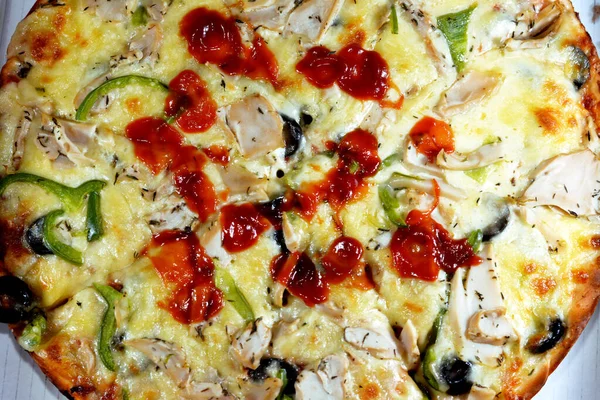 Mushroom pizza with slices of olive, pepper, mozzarella, ketchup and bell pepper, delicious baked fresh pizza with fresh toppings, Italian and American cuisine background, fast junk food concept