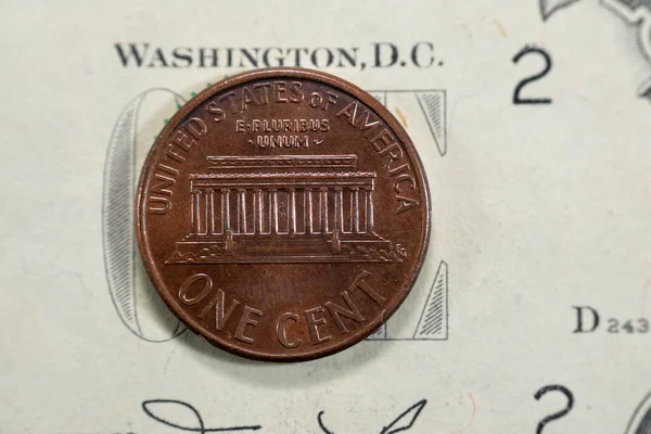 Lincoln Memorial, a U.S. national memorial built to honor the 16th president of the United States of America, Abraham Lincoln from the reverse side of 1 One American cent coin series 2002, old retro